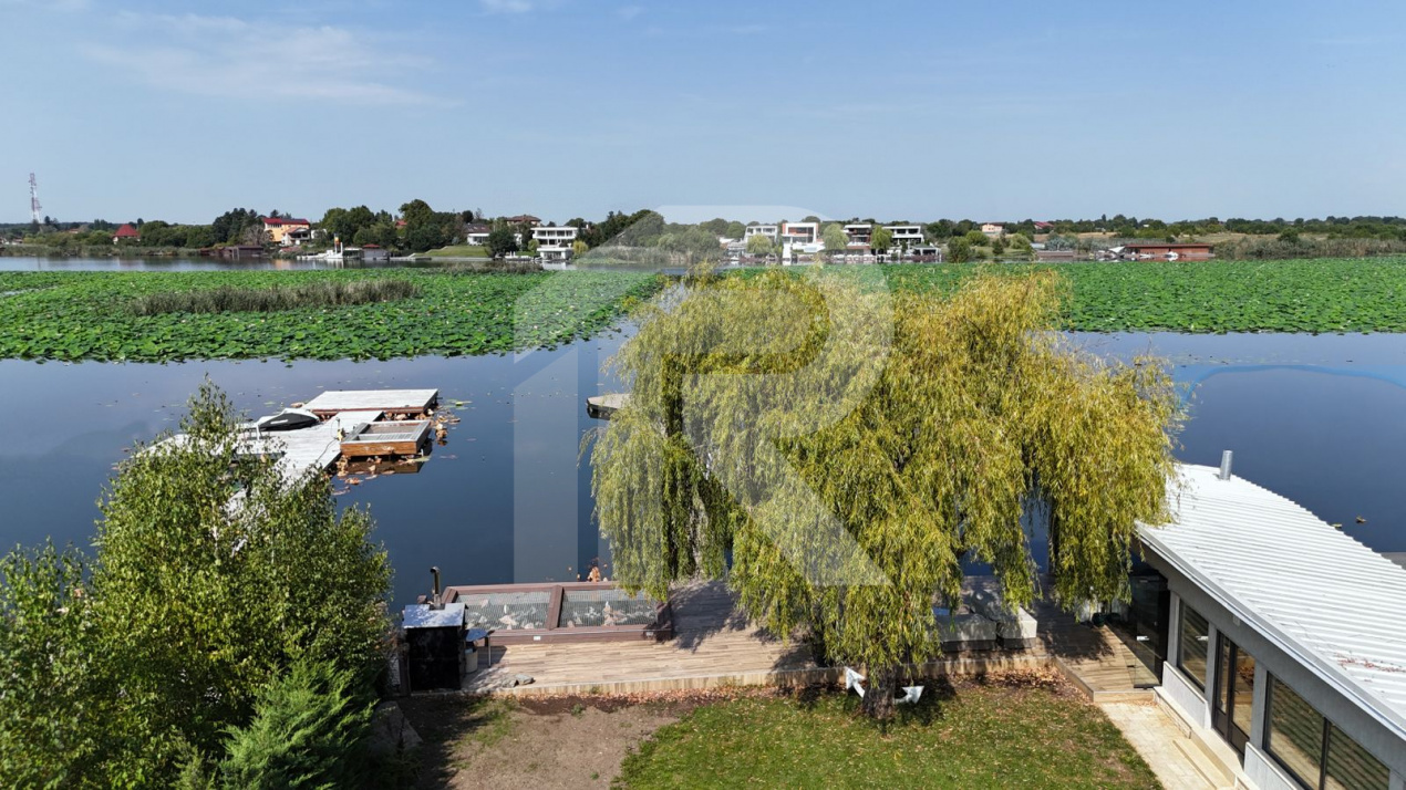 🏡 Reședință modernă 400 mp utili, teren 1.200 mp – deschidere directă la lac